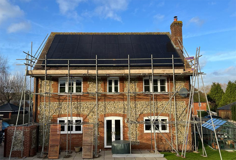 Front view of a house with solar panels on the roof